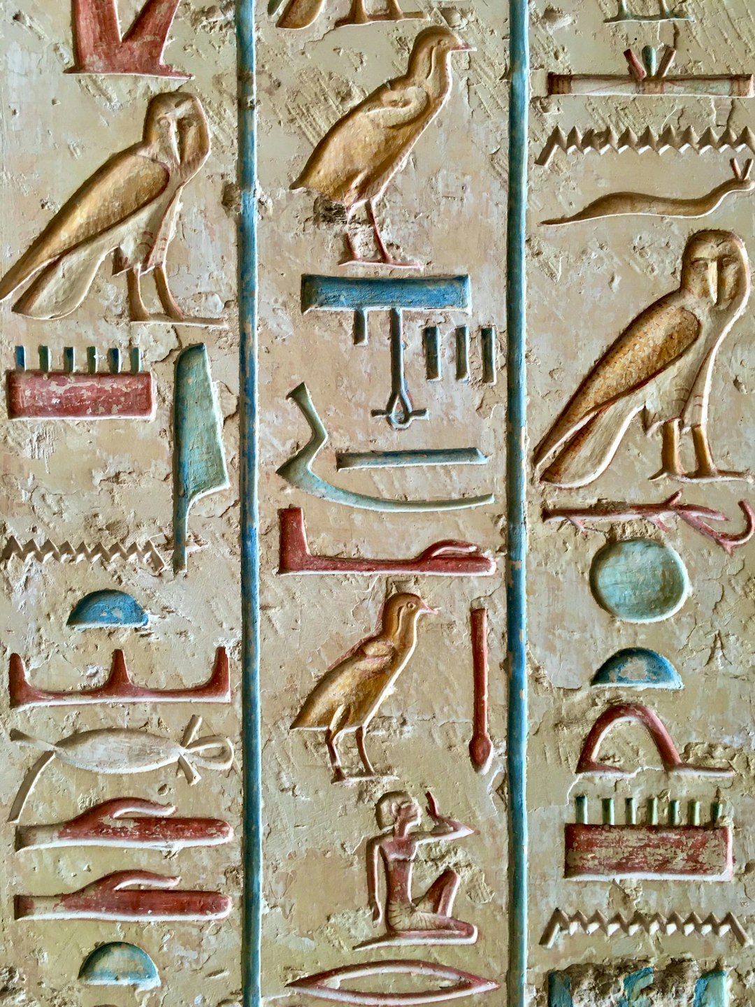 a-close-up-of-a-wall-with-a-painting-on-it-wbwqctcq2xq