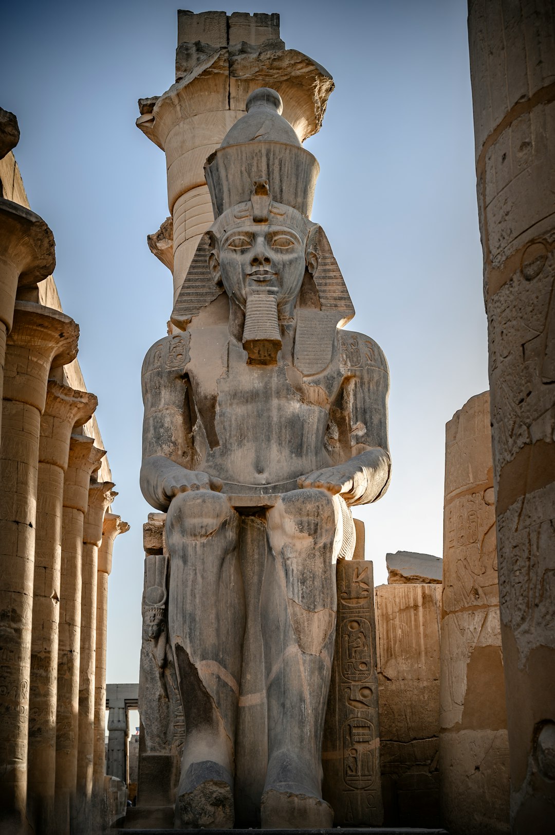 a-statue-of-an-egyptian-god-in-front-of-a-building-thguzd-kekw